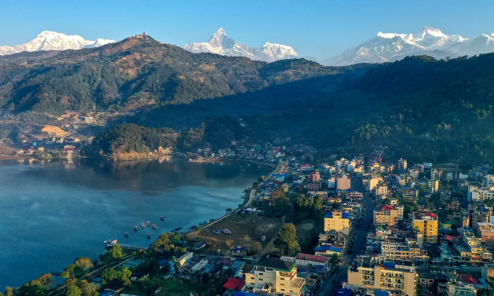 Pokhara captivates with its stunning backdrop, featuring the majestic Machhapuchre mountain