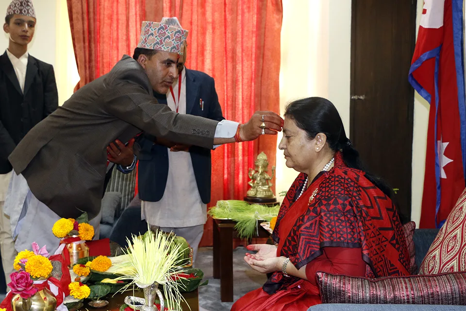 Nepal's Former President Bidya Devi Bhandari receiving Tika and Jamara