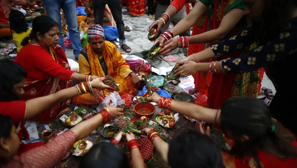 Nepalese Hindu women doing ritual prayers during the Rishi Panchami of Teej Festival